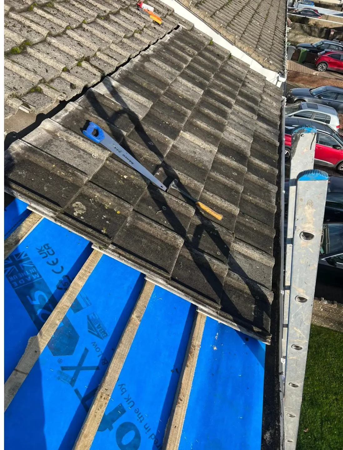 Old concrete tiles being cut and removed on a Dublin roof