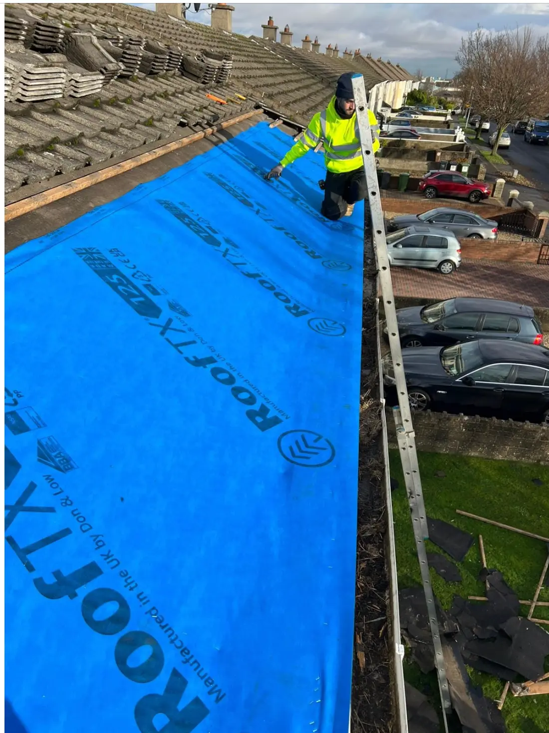 Breather membrane fitted over stripped roof timbers in Dublin